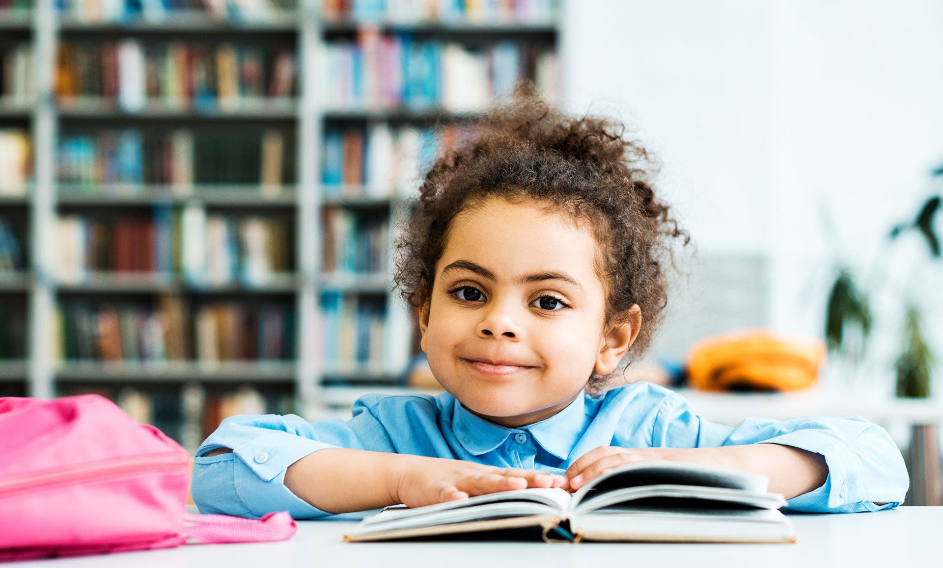 confident child in library